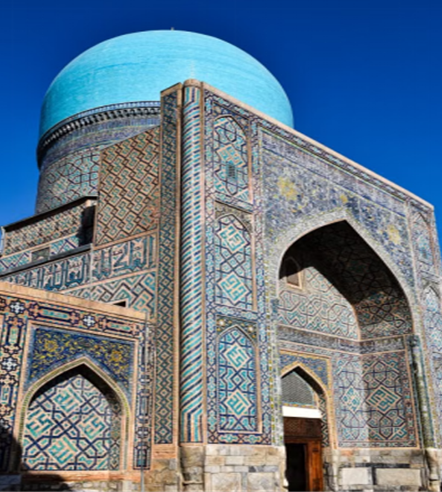 Vibrant mosaic facade and blue dome of Tillya Kari Madrassah in Samarkand, Uzbekistan
